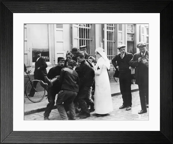 Framed Print : Wounded man in street, Malines, Belgium, WW1