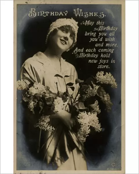 Young woman with flowers on a birthday postcard