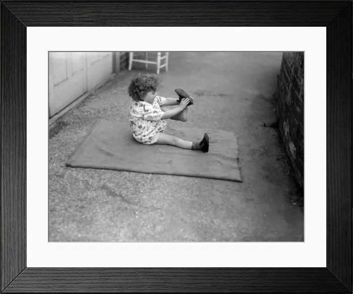 Framed Print : Putting Shoes On Framed Print : Putting Shoes On