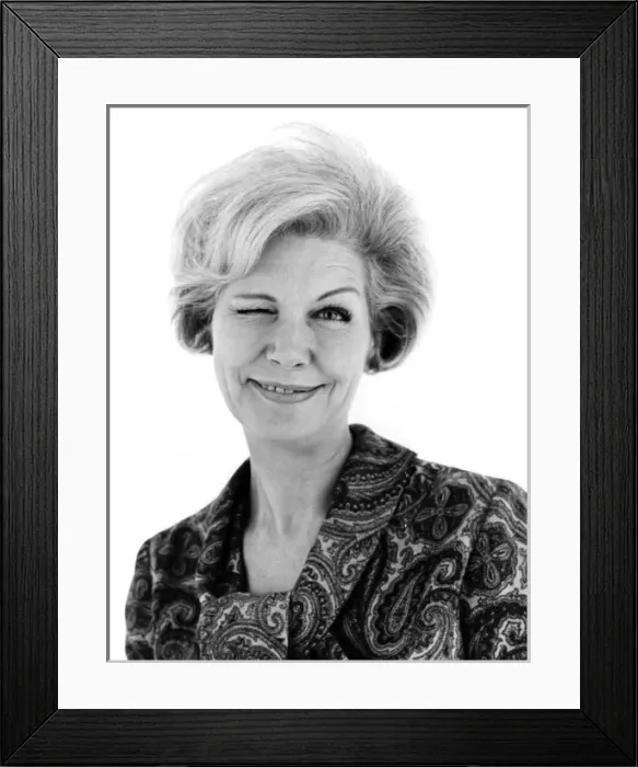 Framed Print : WINKING. A woman winks at the camera. Date: late 1960s Framed Print : WINKING. A woman winks at the camera. Date: late 1960s