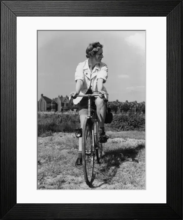 Framed Print : Female Tour Cyclist Framed Print : Female Tour Cyclist
