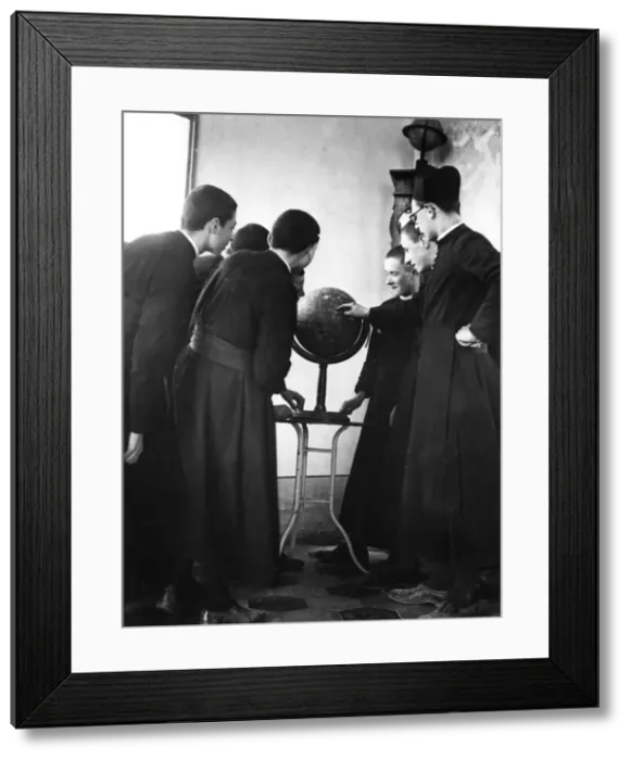 Framed Print : Priests Studying Globe Framed Print : Priests Studying Globe