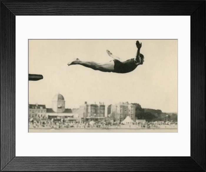 Framed Print : Man diving at a seaside resort Framed Print : Man diving at a seaside resort