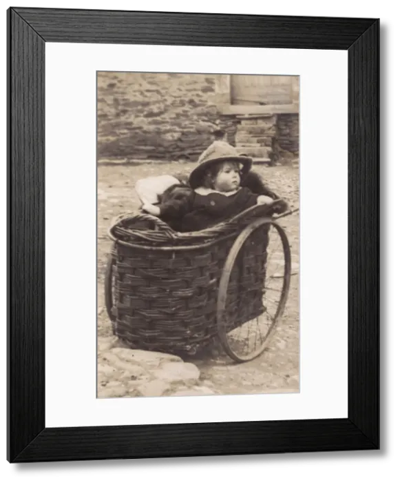 Framed Print : Little girl in a wicker pram Framed Print : Little girl in a wicker pram