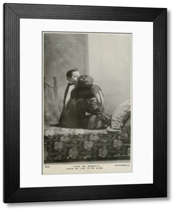 Framed Print : Couple kissing on a chaise longue Framed Print : Couple kissing on a chaise longue