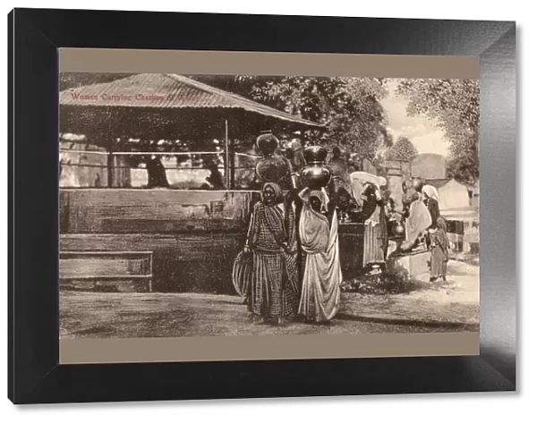 Ambala, India - Women carrying chatties of water
