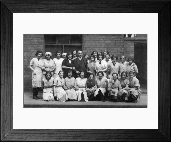 Framed Print : Female factory workers and their male boss