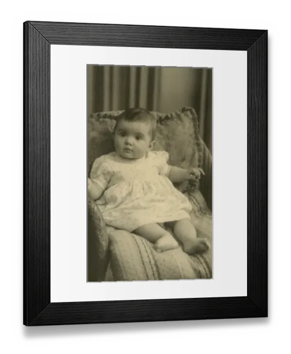 Framed Print : Baby on cushions, sitting up in a chair Framed Print : Baby on cushions, sitting up in a chair