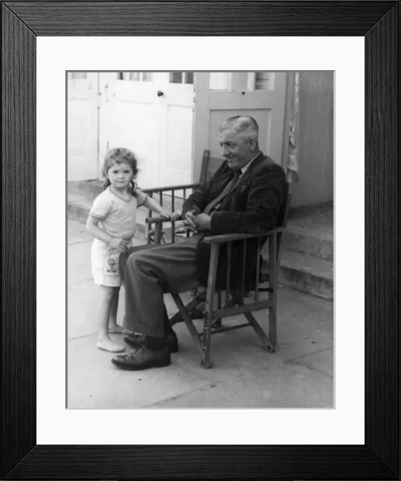 Framed Print : Father and daughter outside beach hut Framed Print : Father and daughter outside beach hut