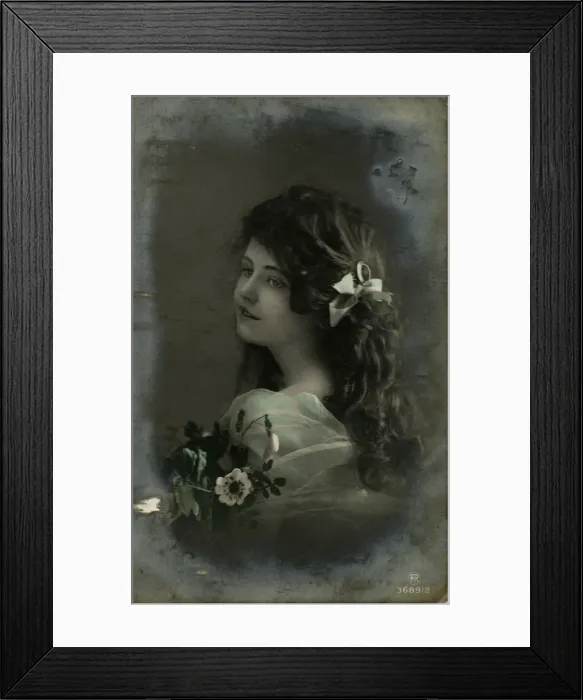 Framed Print : Little girl with dark hair and flowers Framed Print : Little girl with dark hair and flowers