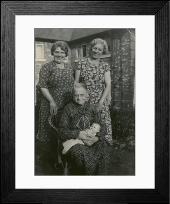 Framed Print : Three women in back garden with doll Framed Print : Three women in back garden with doll