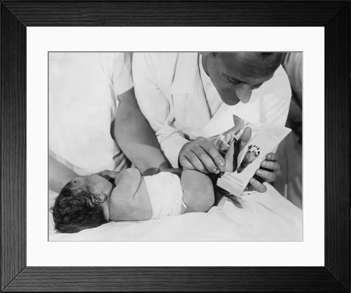 Framed Print : Taking Baby Footprints Framed Print : Taking Baby Footprints