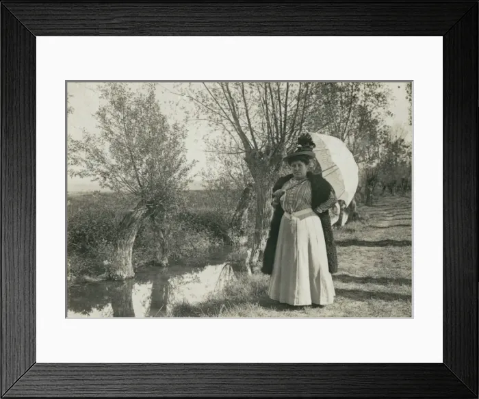 Framed Print : Plump woman with parasol by a stream Framed Print : Plump woman with parasol by a stream