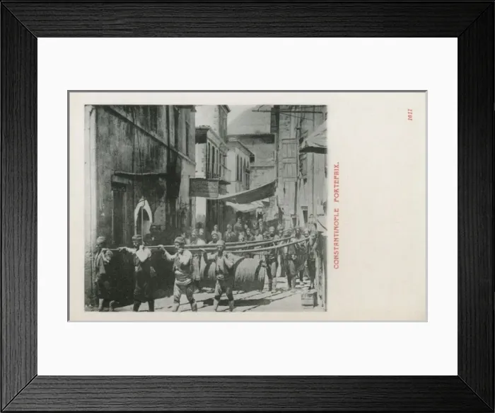 Framed Print : Turkish Porters carry large barrel Framed Print : Turkish Porters carry large barrel
