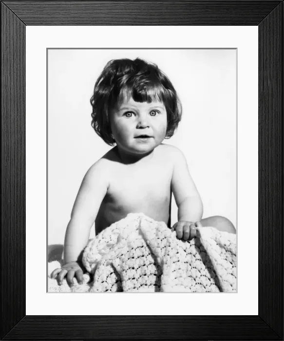 Framed Print : A BABY. A baby with a blanket. Date: late 1960s Framed Print : A BABY. A baby with a blanket. Date: late 1960s