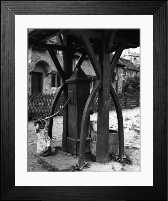 Framed Print : Girl Pumping Water Framed Print : Girl Pumping Water