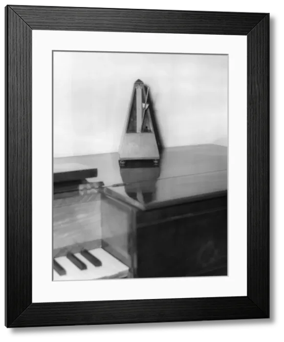 Framed Print : Metronome on a Piano Framed Print : Metronome on a Piano