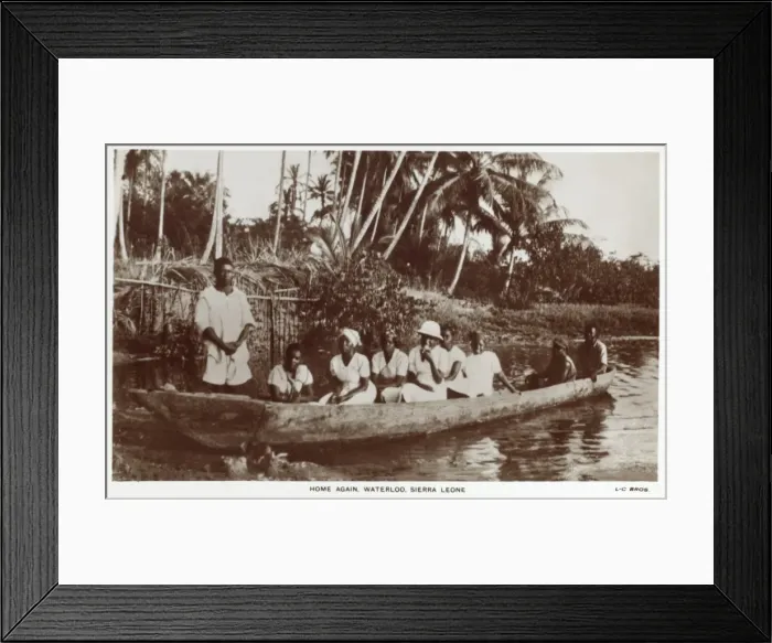 Framed Print : Sierra Leone - Family in a log canoe Framed Print : Sierra Leone - Family in a log canoe