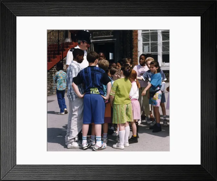 Framed Print : Metropolitan Police officer in school playground Framed Print : Metropolitan Police officer in school playground