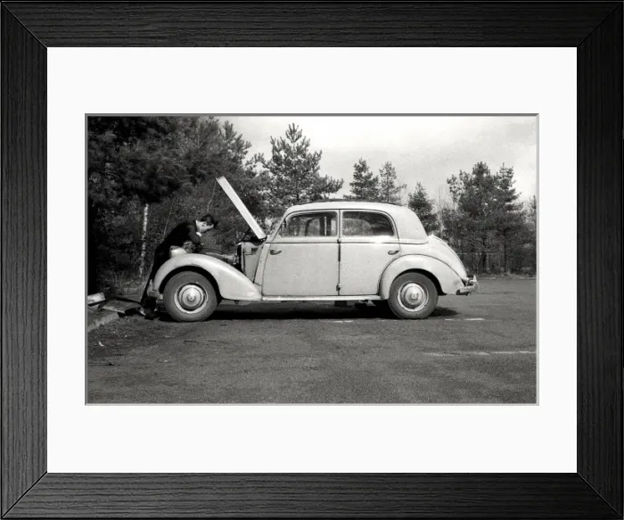 Framed Print : Fixing a car Framed Print : Fixing a car