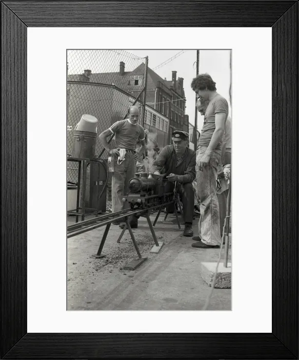 Framed Print : Train driver prepares engine on model steam train Framed Print : Train driver prepares engine on model steam train