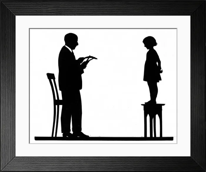 Framed Print : Silhouette artist cutting a childs portrait Framed Print : Silhouette artist cutting a childs portrait