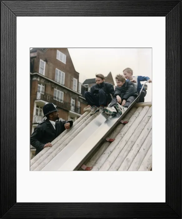 Framed Print : Metropolitan Police officers with boys on slide Framed Print : Metropolitan Police officers with boys on slide