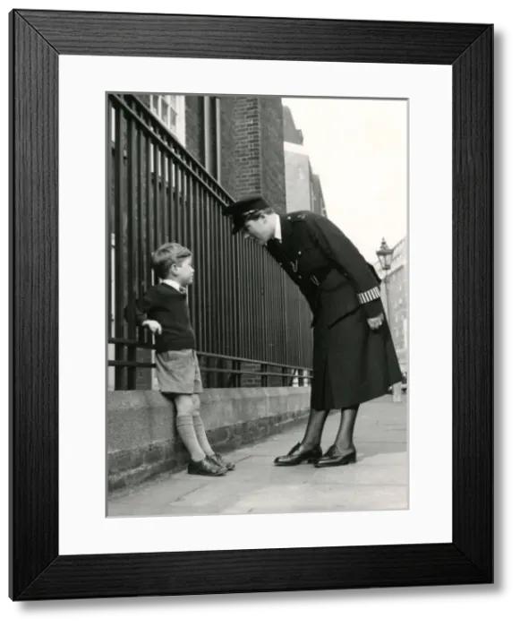 Framed Print : Metropolitan Police officer speaking to a little boy Framed Print : Metropolitan Police officer speaking to a little boy