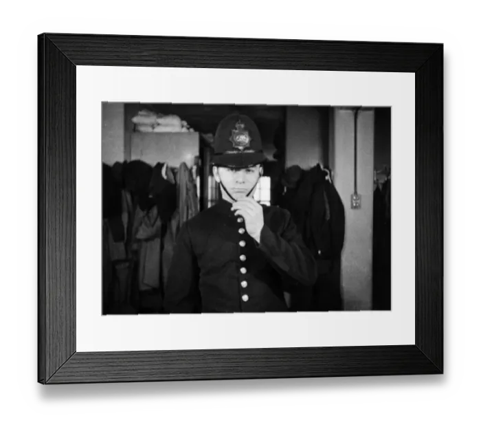Framed Print : Metropolitan Police officer fitted with his uniform Framed Print : Metropolitan Police officer fitted with his uniform