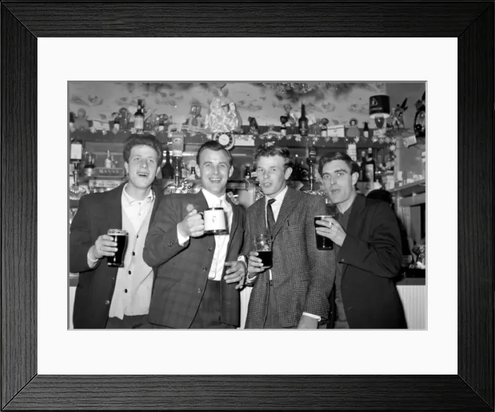 Framed Print : Four young men enjoying a pint of beer, Walton, Essex Framed Print : Four young men enjoying a pint of beer, Walton, Essex