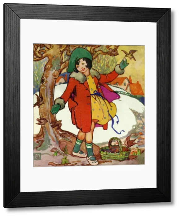 Framed Print : Winter scene. Young girl feeding the birds Framed Print : Winter scene. Young girl feeding the birds