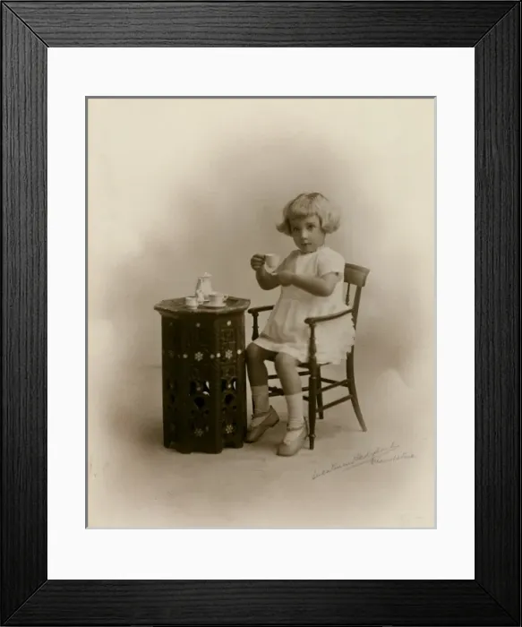 Framed Print : Little girl with miniature tea set