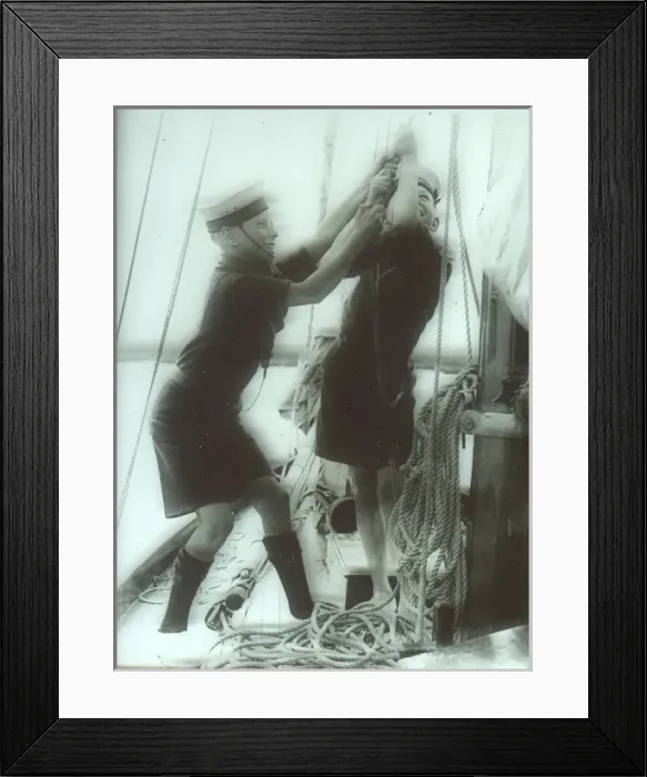 Framed Print : Two Sea Scouts hosting a sail on a ship Framed Print : Two Sea Scouts hosting a sail on a ship