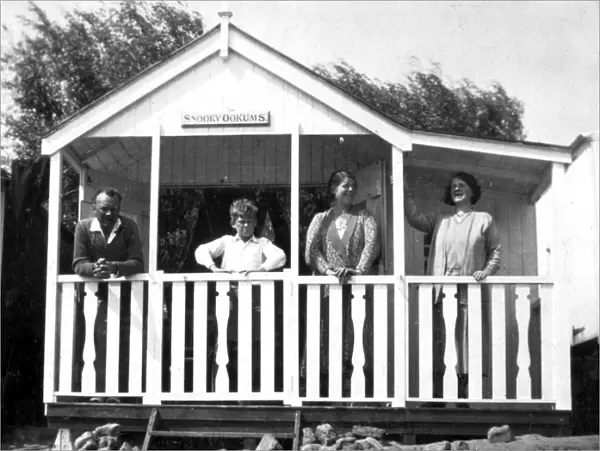 People in a typical beach hut or chalet, Walton, Essex