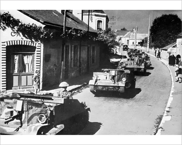 British machine gun carriers passing through French village