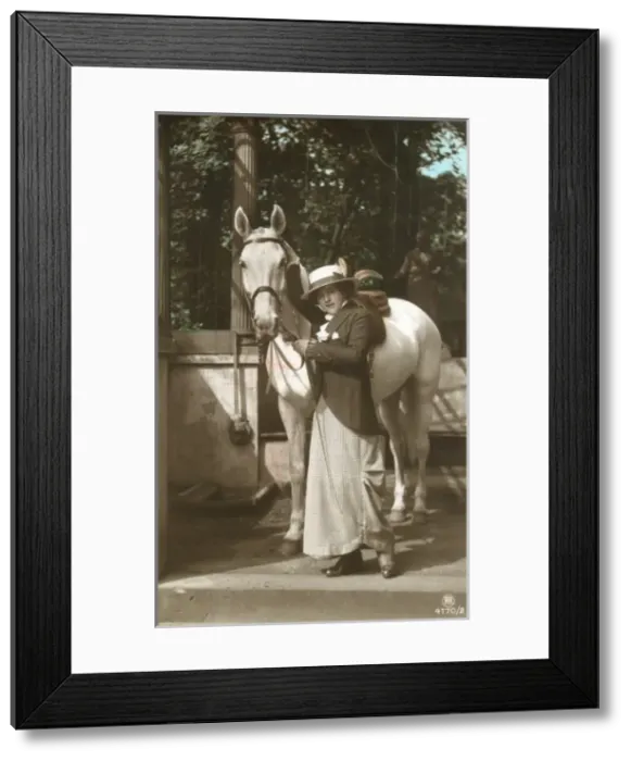 Framed Print : A young lady with her fine grey horse Framed Print : A young lady with her fine grey horse