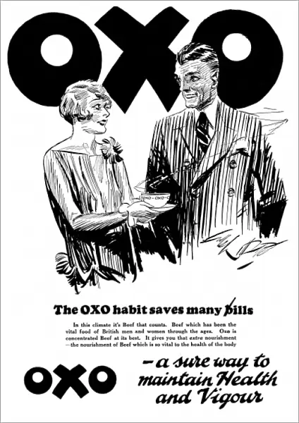 A wife giveing her husband a cup of Oxo