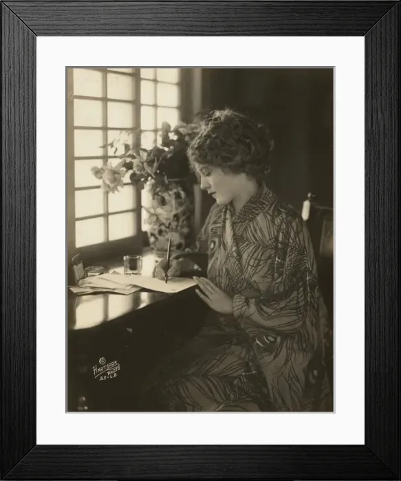 Framed Print : Mary Pickford, wearing a kimono, writing at a desk Framed Print : Mary Pickford, wearing a kimono, writing at a desk