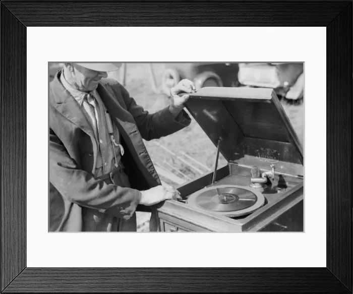 Framed Print : Farmer examining phonograph. Auction near Tenstrike, Minneso Framed Print : Farmer examining phonograph. Auction near Tenstrike, Minneso