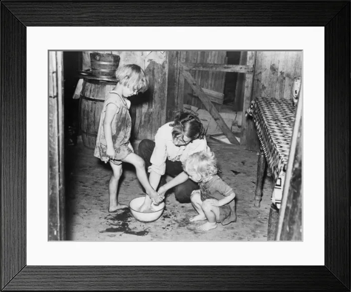 Framed Print : Mother washing feet and cleaning up daughters in sharecroppe Framed Print : Mother washing feet and cleaning up daughters in sharecroppe