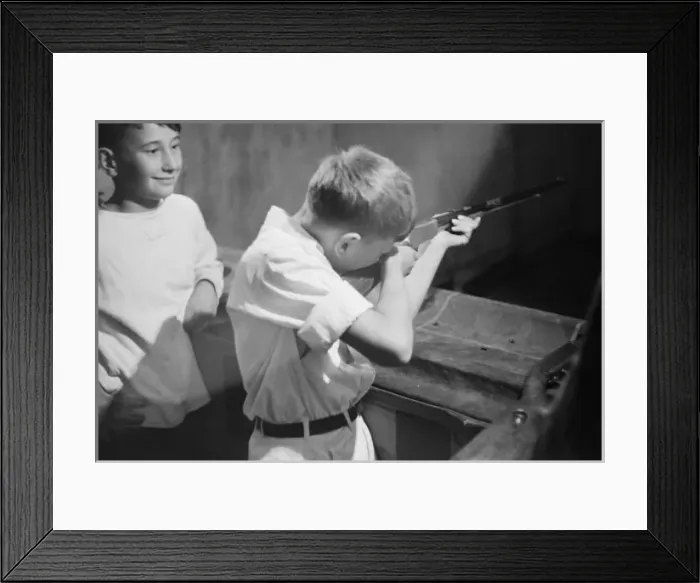 Framed Print : Boy shooting during carnival at firemens convention, Sturge Framed Print : Boy shooting during carnival at firemens convention, Sturge