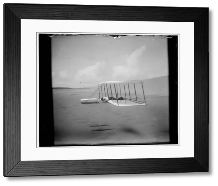 Framed Print : Wilbur Wright in prone position on glider just after landing Framed Print : Wilbur Wright in prone position on glider just after landing