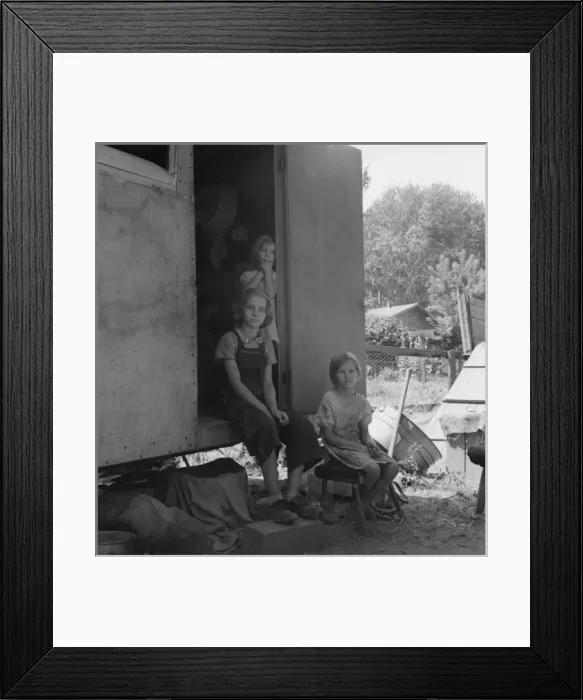 Framed Print : The oldest girl seated in the doorway of the house trailer c Framed Print : The oldest girl seated in the doorway of the house trailer c