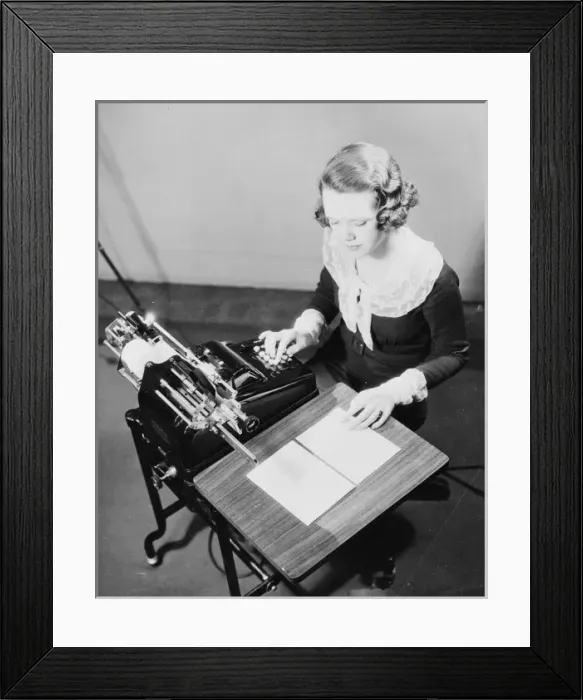 Framed Print : Girl using adding machine Framed Print : Girl using adding machine