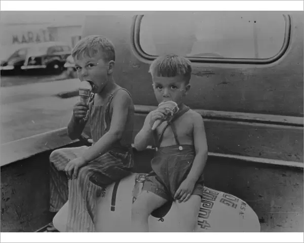 Farm boys eating ice-cream cones. Washington, Indiana