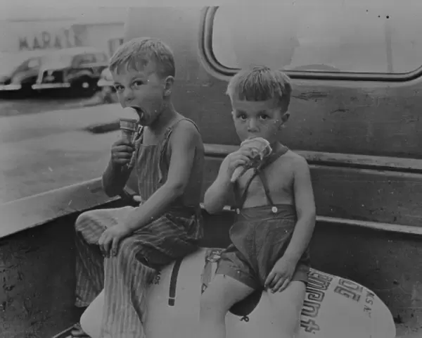 Farm boys eating ice-cream cones. Washington, Indiana