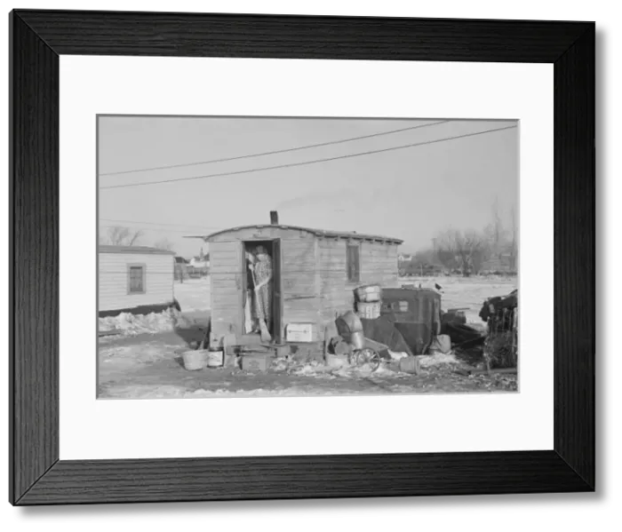 Framed Print : Mrs. Charles Benning sweeping steps of shack in Shantytown Framed Print : Mrs. Charles Benning sweeping steps of shack in Shantytown