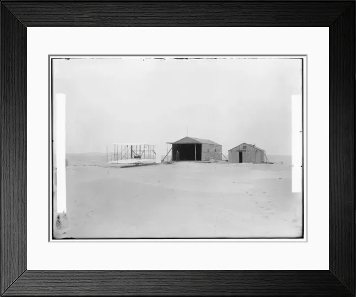 Framed Print : 1903 machine and large camp building where it was housed, an Framed Print : 1903 machine and large camp building where it was housed, an