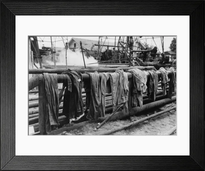 Framed Print : Clothing of oil drilling workers drying on steam pipe, Kilgo Framed Print : Clothing of oil drilling workers drying on steam pipe, Kilgo