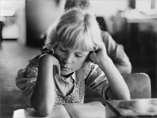Child studying in school, Southeast Missouri Farms